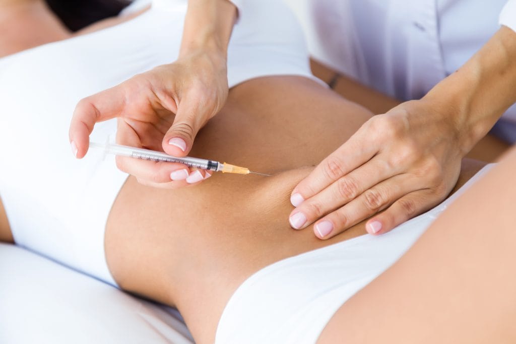 surgeon-making-injection-into-female-body-liposuction-concept-1024x683